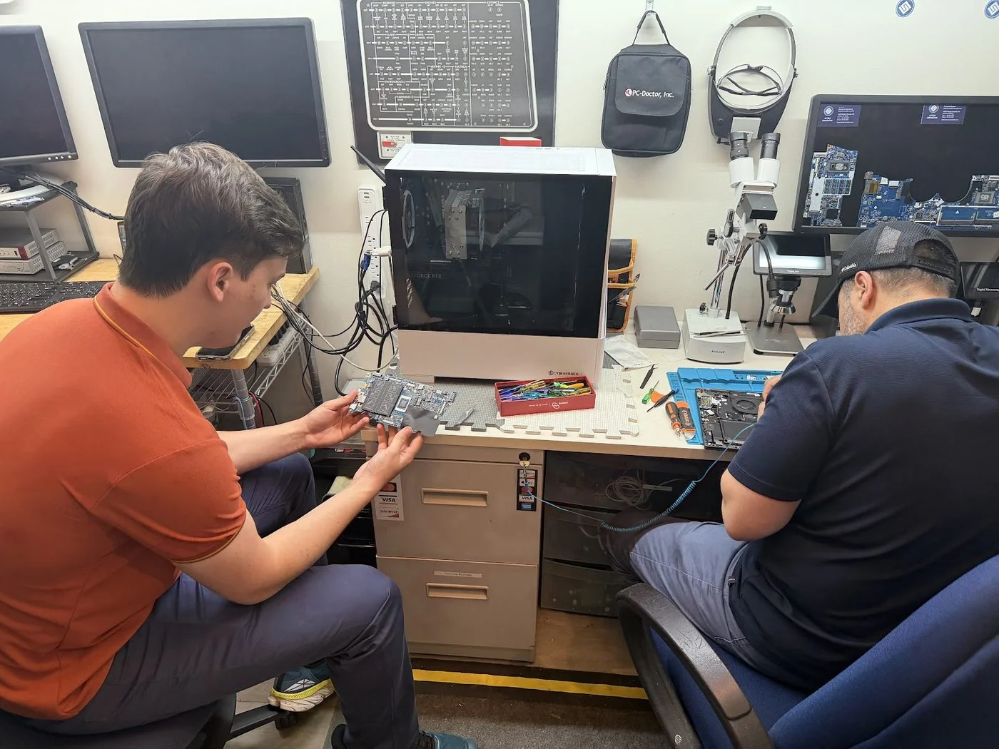 AZ Tech Services technicians performing board-level diagnostics for computer repair and a custom PC build in Ashburn
